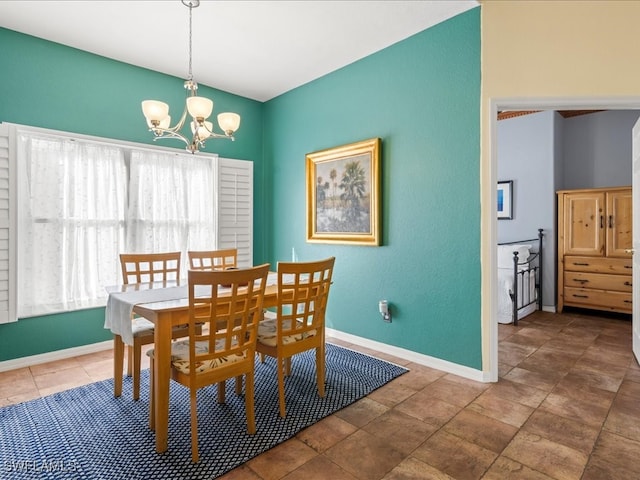 dining room featuring a notable chandelier