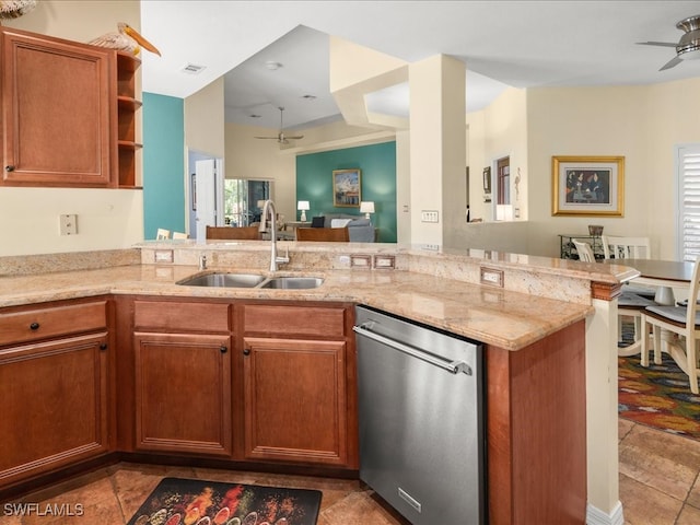 kitchen featuring dishwasher, kitchen peninsula, sink, and a wealth of natural light