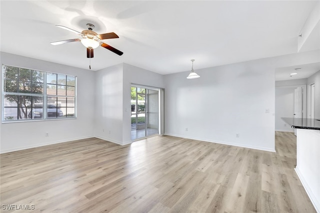 interior space featuring ceiling fan and light wood-type flooring