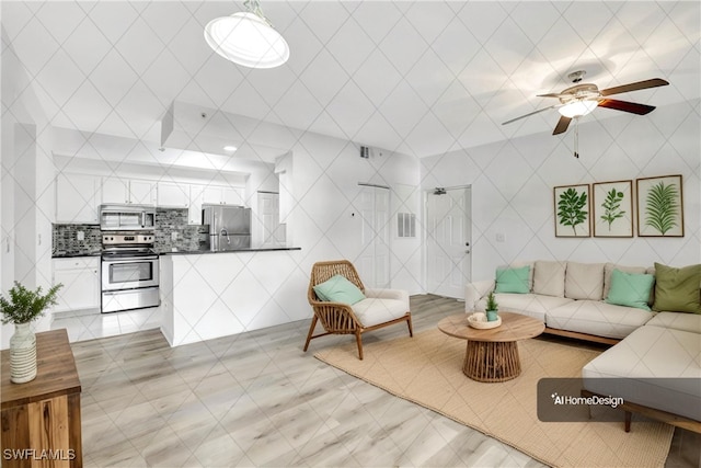 tiled living room with ceiling fan