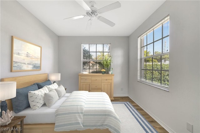 bedroom featuring wood-type flooring and ceiling fan