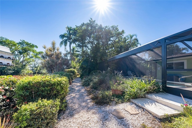 view of yard with a lanai