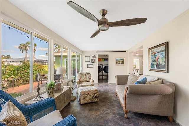 living room with ceiling fan and washer and clothes dryer