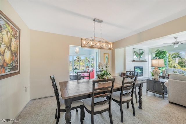 dining space featuring a healthy amount of sunlight and an inviting chandelier