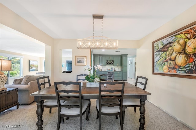 dining room featuring light colored carpet