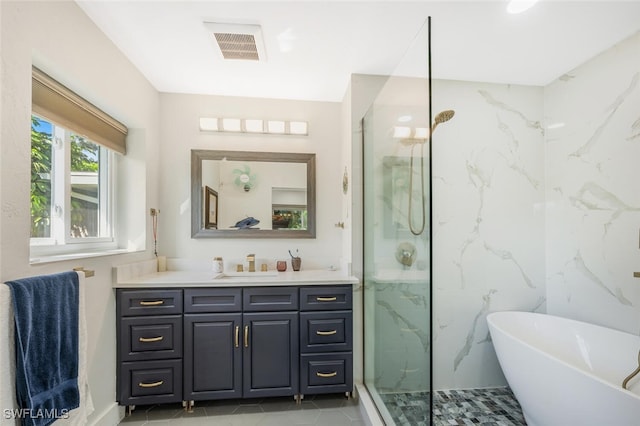 bathroom with vanity, independent shower and bath, and tile patterned flooring