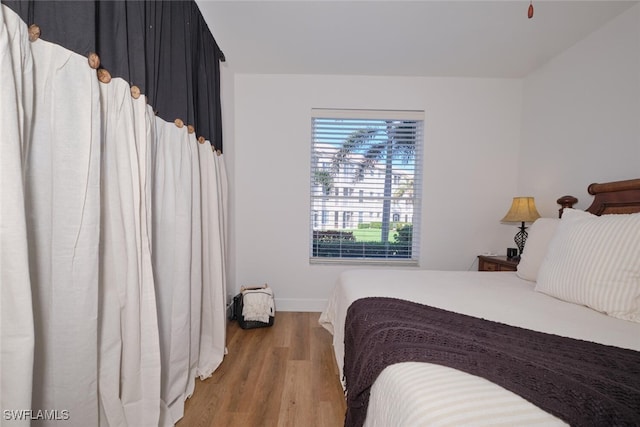 bedroom featuring wood-type flooring