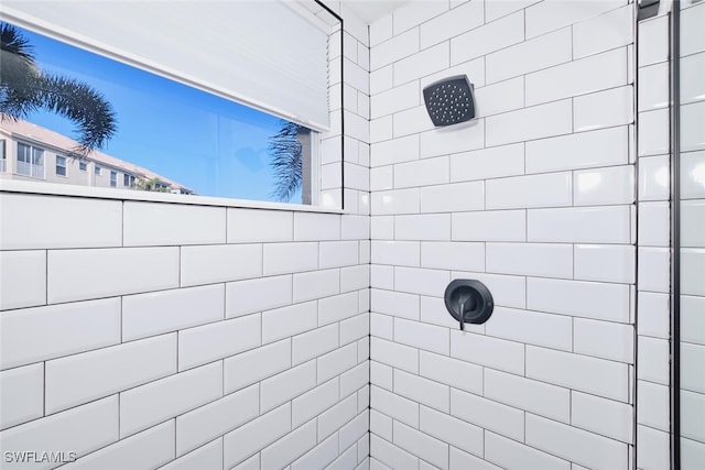 bathroom with a tile shower