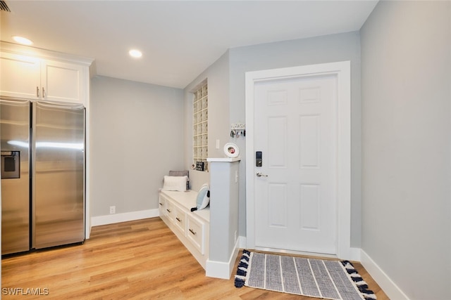 mudroom with light wood-type flooring