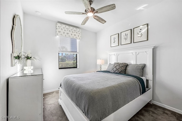 bedroom with dark colored carpet and ceiling fan