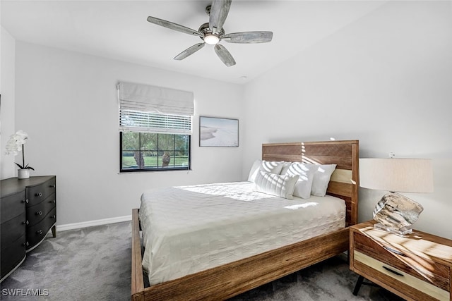 bedroom with dark colored carpet and ceiling fan