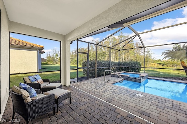 view of pool featuring glass enclosure, an in ground hot tub, a yard, and a patio