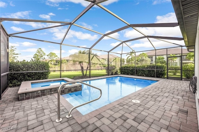 view of swimming pool with an in ground hot tub, a patio, and glass enclosure