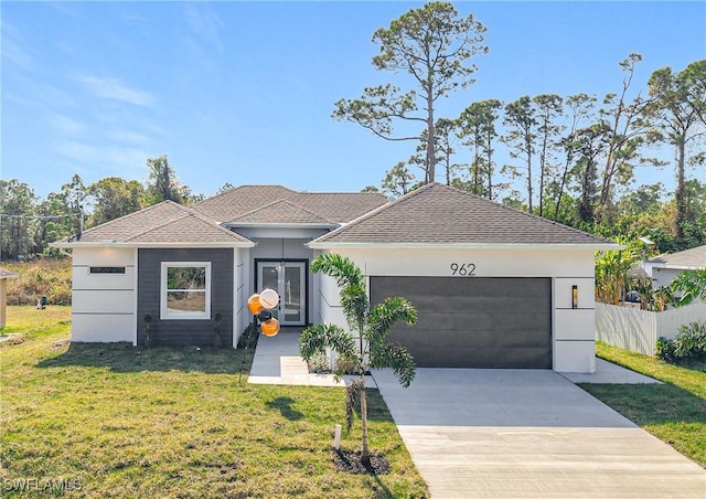 single story home with a garage and a front lawn