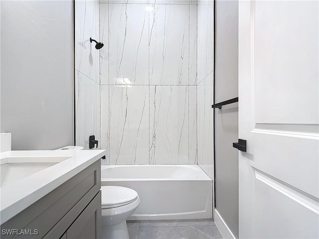 full bathroom featuring tile patterned floors, vanity, toilet, and tiled shower / bath combo