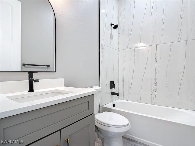 full bathroom featuring vanity, toilet, and tiled shower / bath