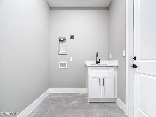 laundry room with hookup for a washing machine, sink, cabinets, and hookup for an electric dryer