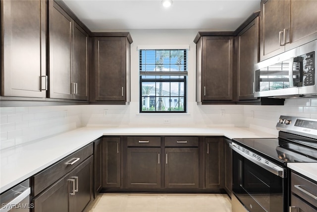 kitchen with decorative backsplash, dark brown cabinetry, and stainless steel appliances