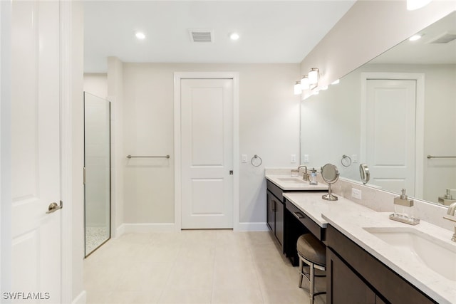 bathroom with tile patterned floors, a shower, and vanity