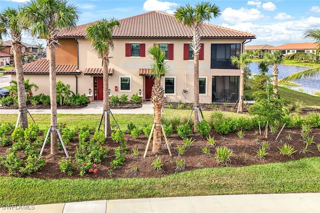 view of front of property with a water view