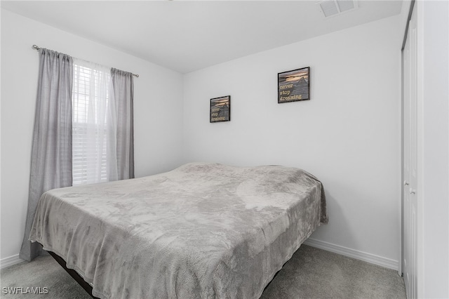 bedroom featuring light colored carpet