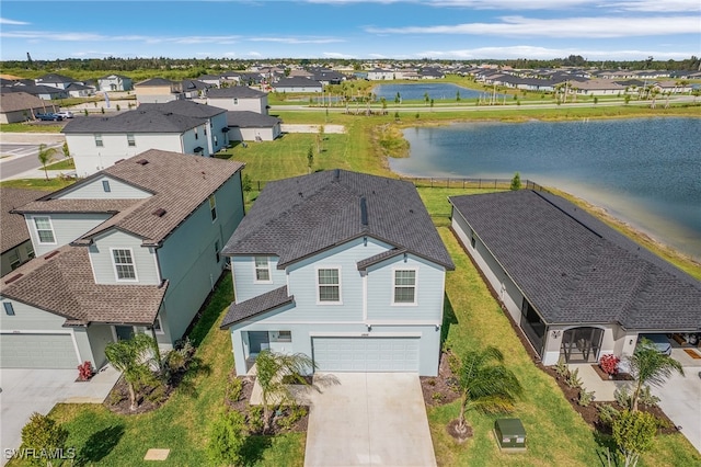 drone / aerial view with a water view