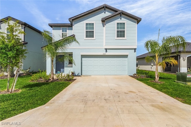 view of front property featuring a front yard and a garage