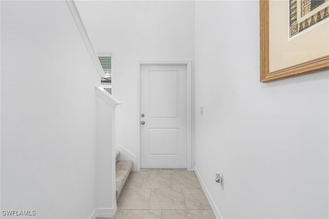 hallway featuring light tile patterned floors