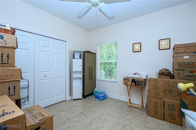 interior space with ceiling fan