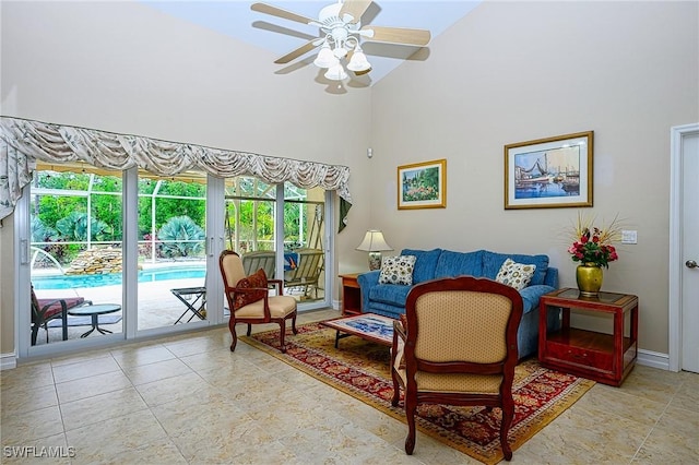 living room featuring a wealth of natural light, high vaulted ceiling, and ceiling fan