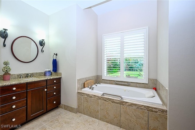 bathroom featuring vanity and a relaxing tiled tub