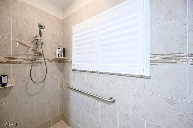 bathroom with a tile shower