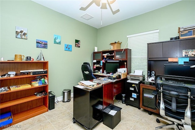 tiled office space featuring ceiling fan