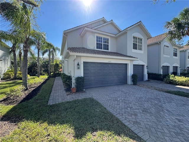 view of front of home featuring a garage and a front yard