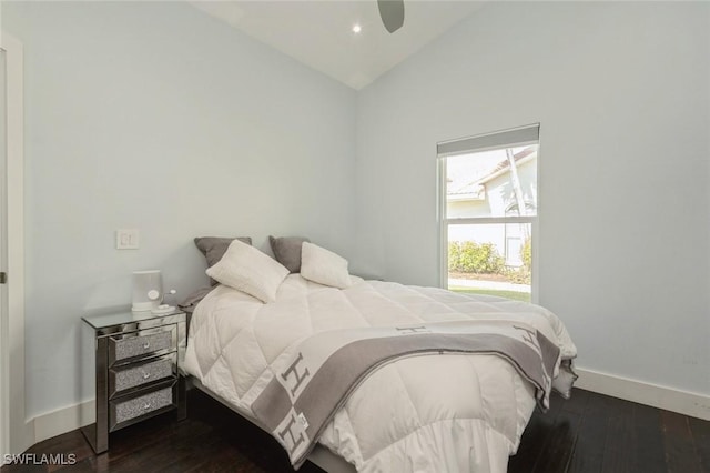 bedroom with lofted ceiling, ceiling fan, and dark hardwood / wood-style floors