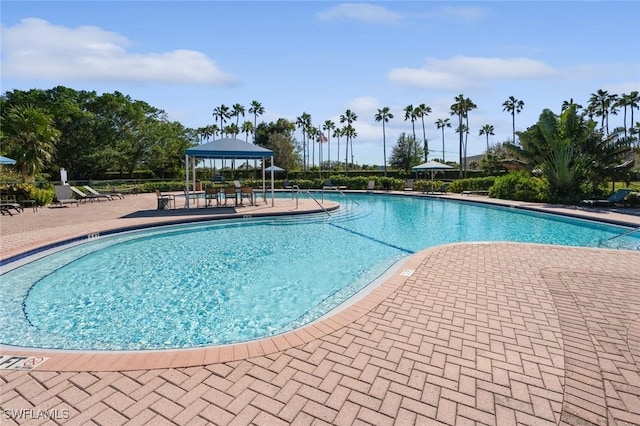 view of pool with a gazebo and a patio