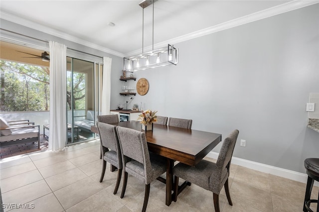 dining area with crown molding, light tile patterned flooring, and ceiling fan