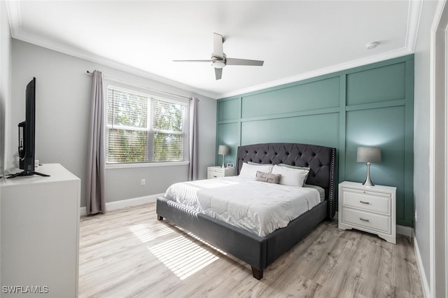 bedroom with ornamental molding, ceiling fan, and light hardwood / wood-style floors