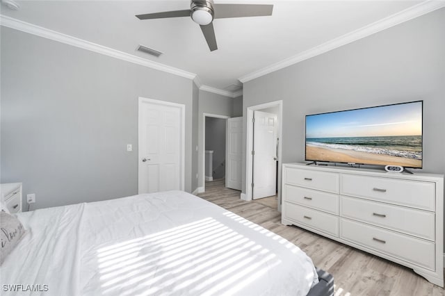 bedroom with ornamental molding, light hardwood / wood-style floors, and ceiling fan