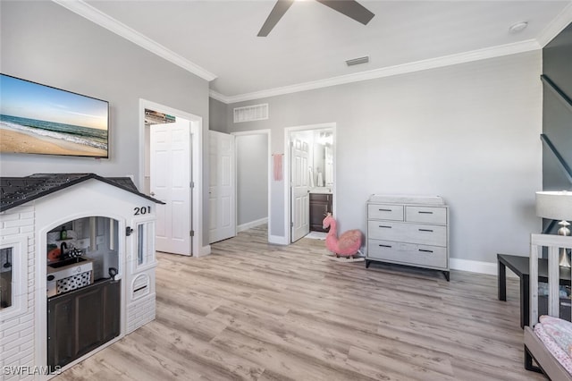 interior space with crown molding, ceiling fan, and light hardwood / wood-style flooring