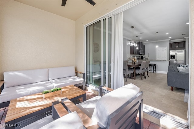 interior space with crown molding and ceiling fan