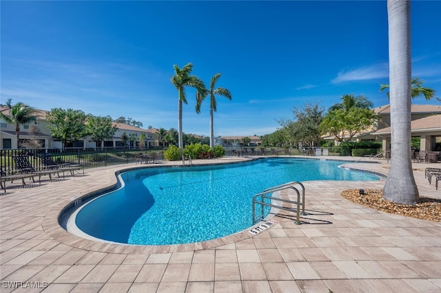 view of swimming pool featuring a patio area