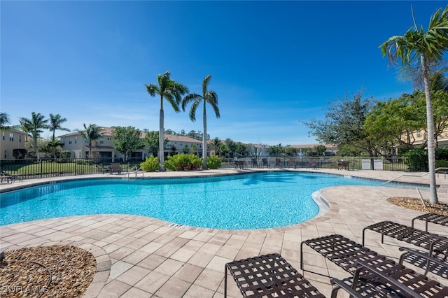 view of swimming pool featuring a patio