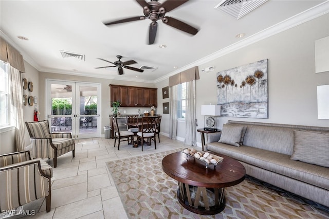 living room with french doors and crown molding