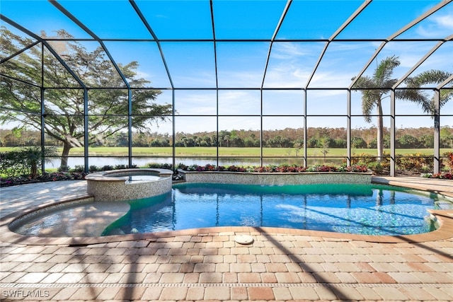 view of swimming pool featuring an in ground hot tub, a water view, glass enclosure, and a patio area