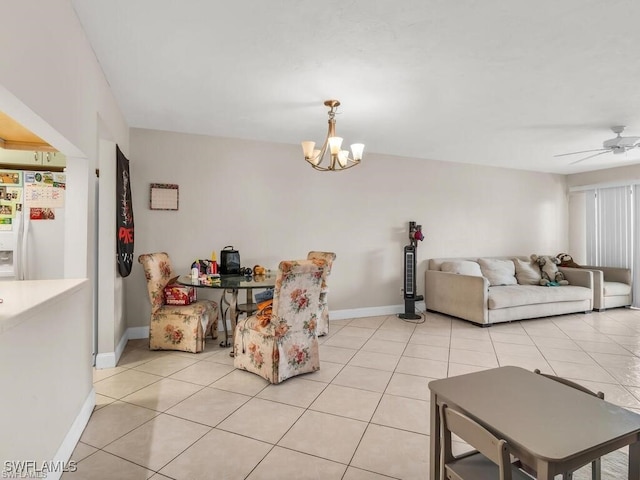 dining room with light tile patterned floors and ceiling fan with notable chandelier