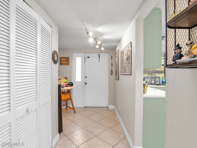 entryway featuring light tile patterned floors