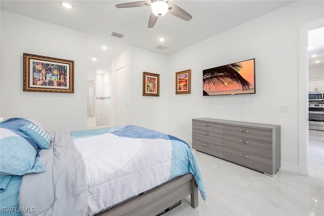 bedroom featuring ensuite bath and ceiling fan