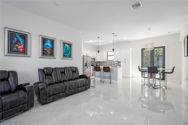 living room with a notable chandelier