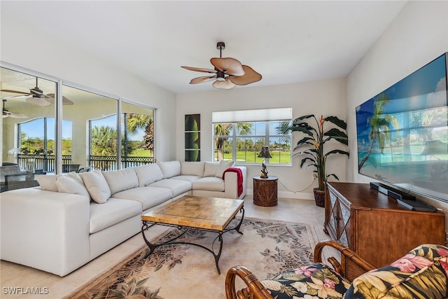 tiled living room featuring ceiling fan